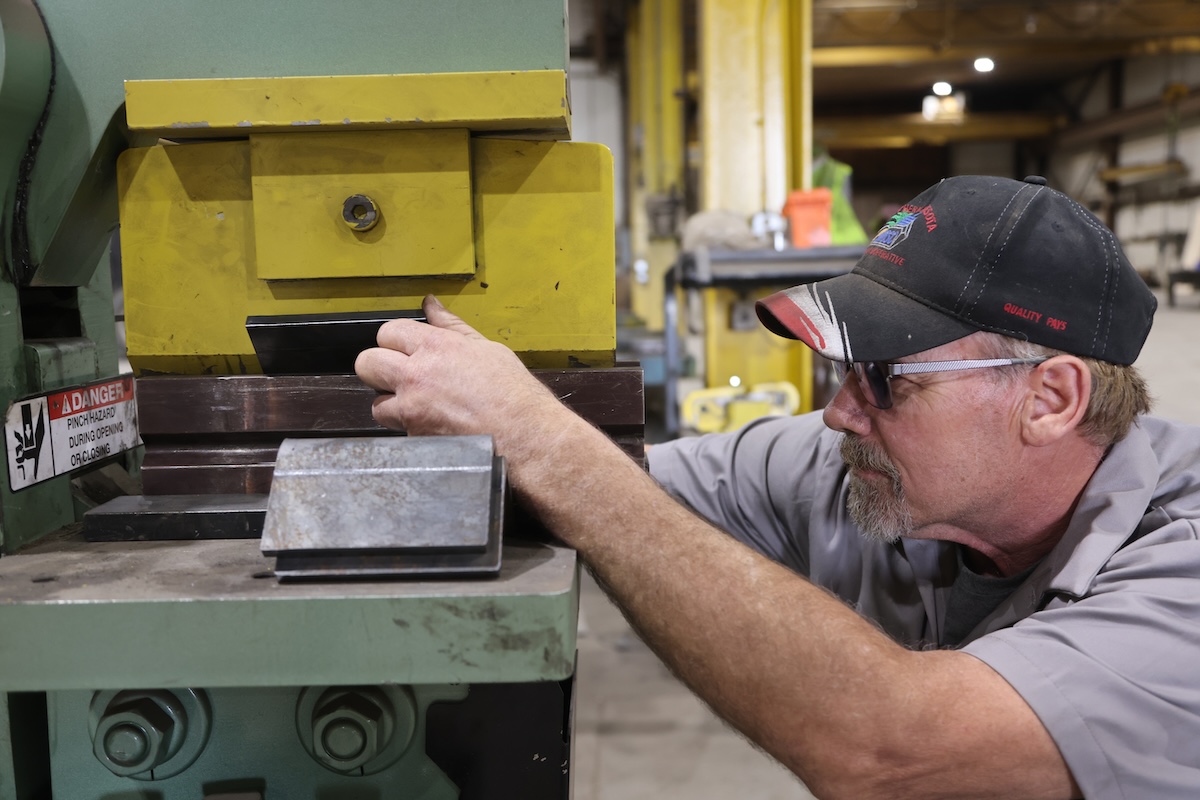 Worker operating ironworker machine